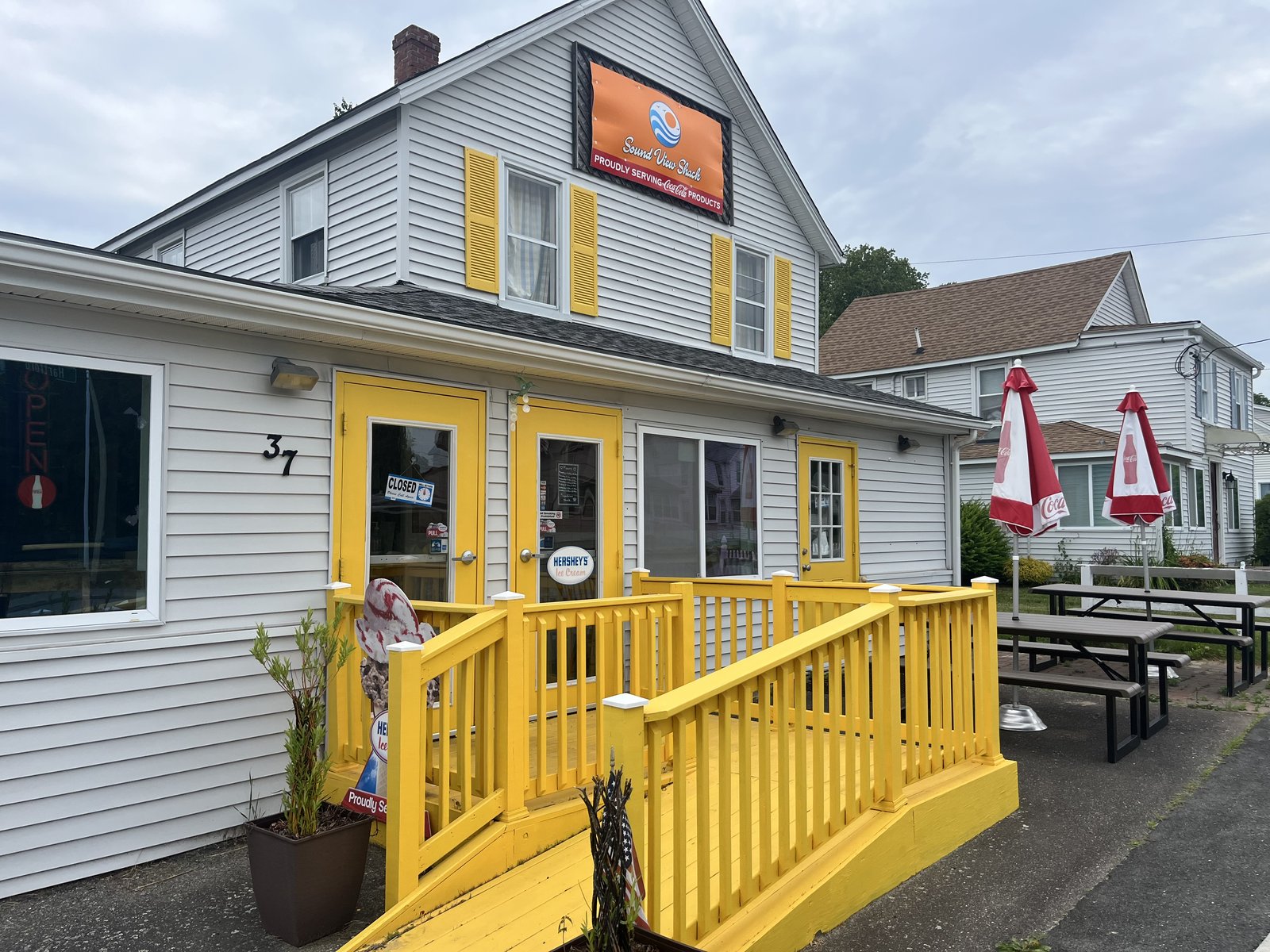 Stop by — yellow railings & outdoor seating